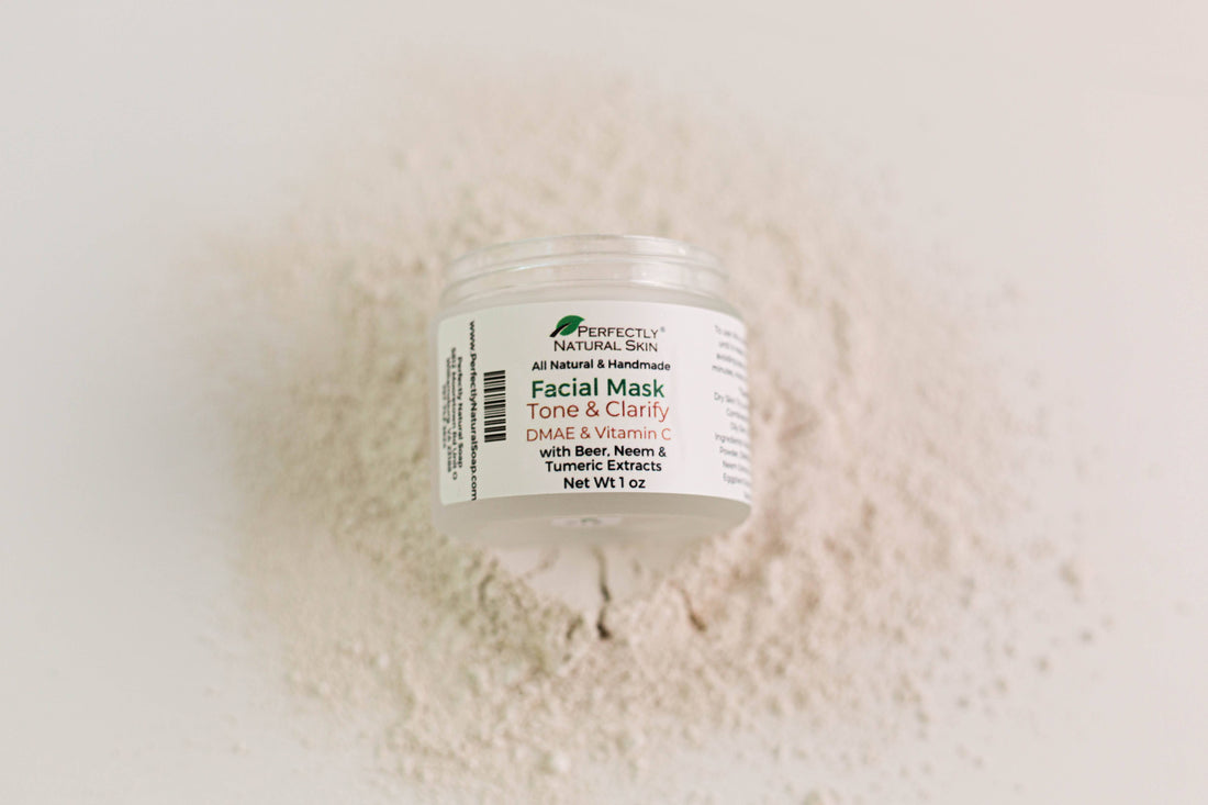 Jar of Tone & Clarify Facial Mask placed in a splash of the mask on a solid beige background